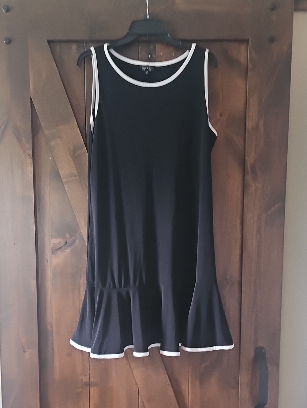 Black Sleeveless Ruffle-Hem Tank Top with White Trim